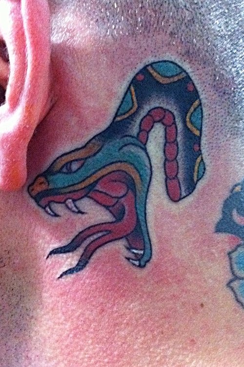 Traditional Snake Tattoo On Man Left Behind The Ear