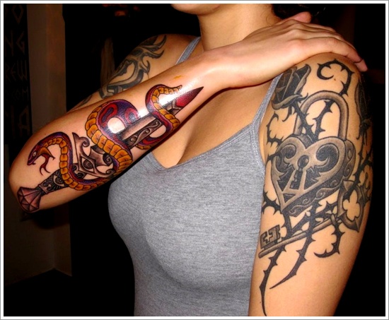 Traditional Snake With Dagger Tattoo On Women Right Arm