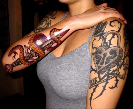 Traditional Snake With Dagger Tattoo On Women Right Arm