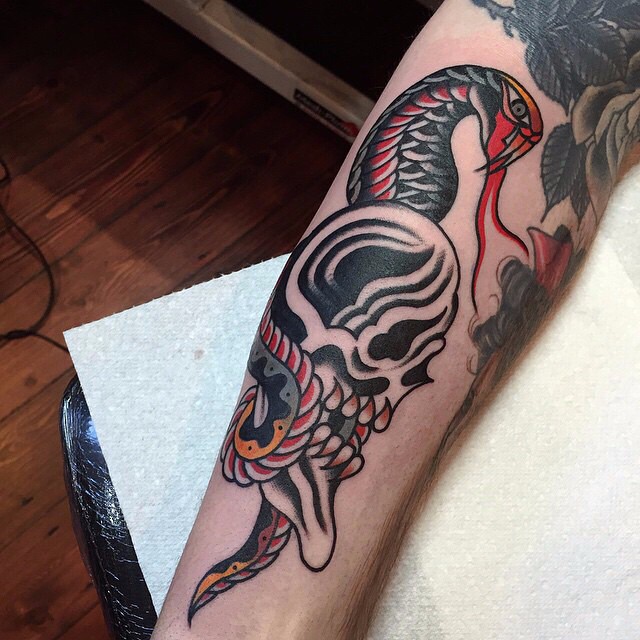 Traditional Snake With Skull Tattoo On Right Arm