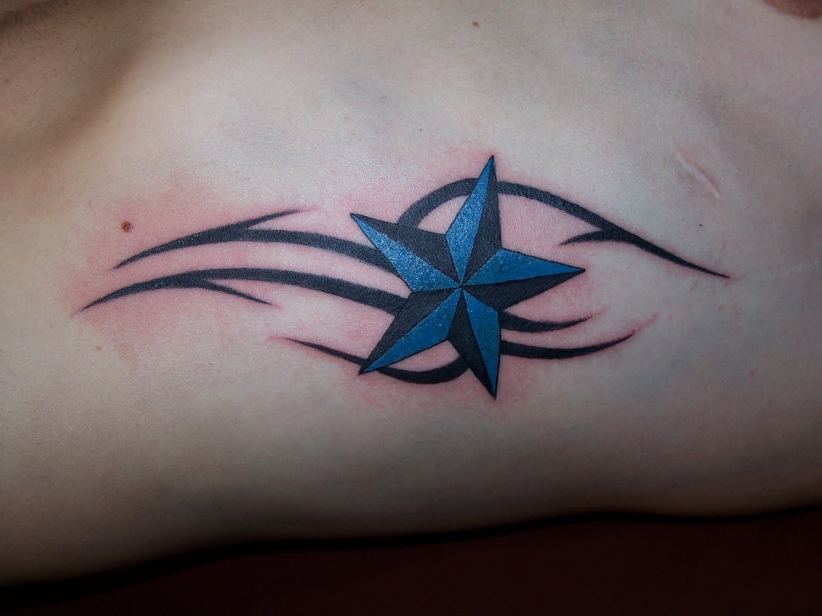 Tribal And Blue Nautical Star Tattoo