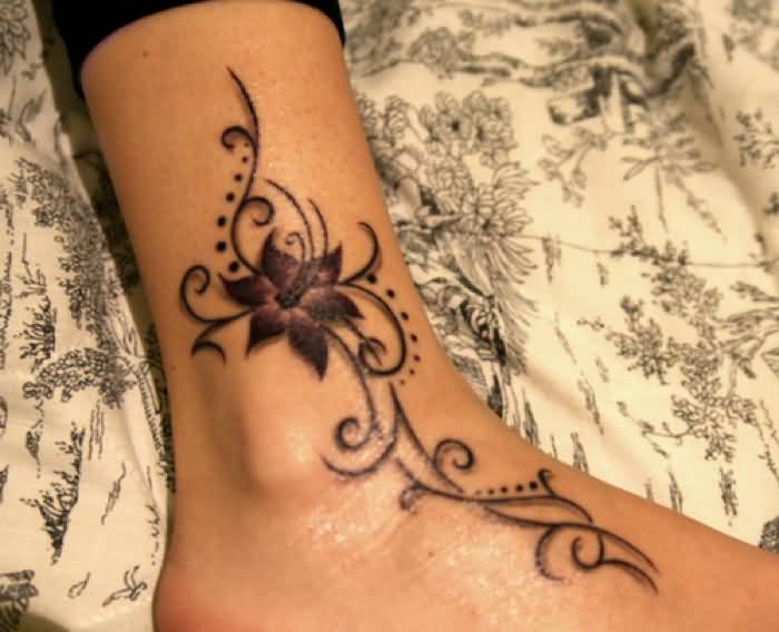 Tribal And Lily Tattoo On Ankle