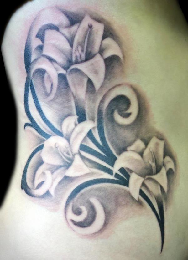 Tribal and lily Flower Tattoo On Side Rib