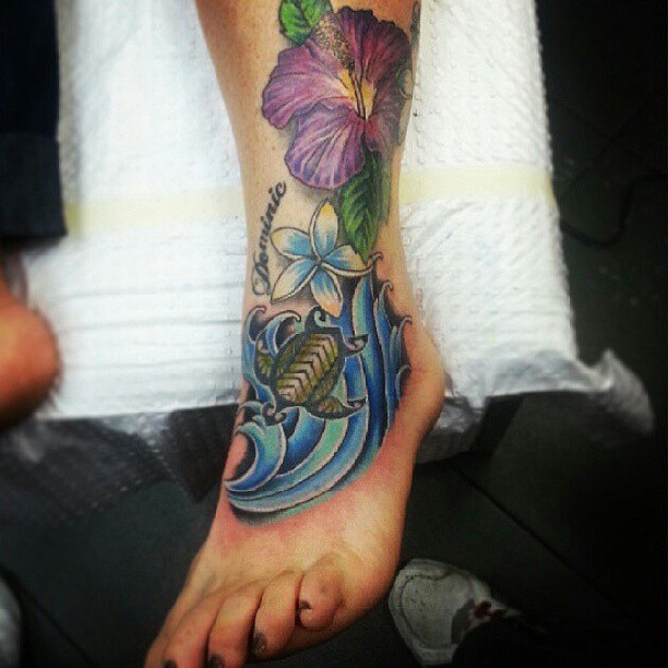 Turtle And Lily Tattoo On Left Ankle