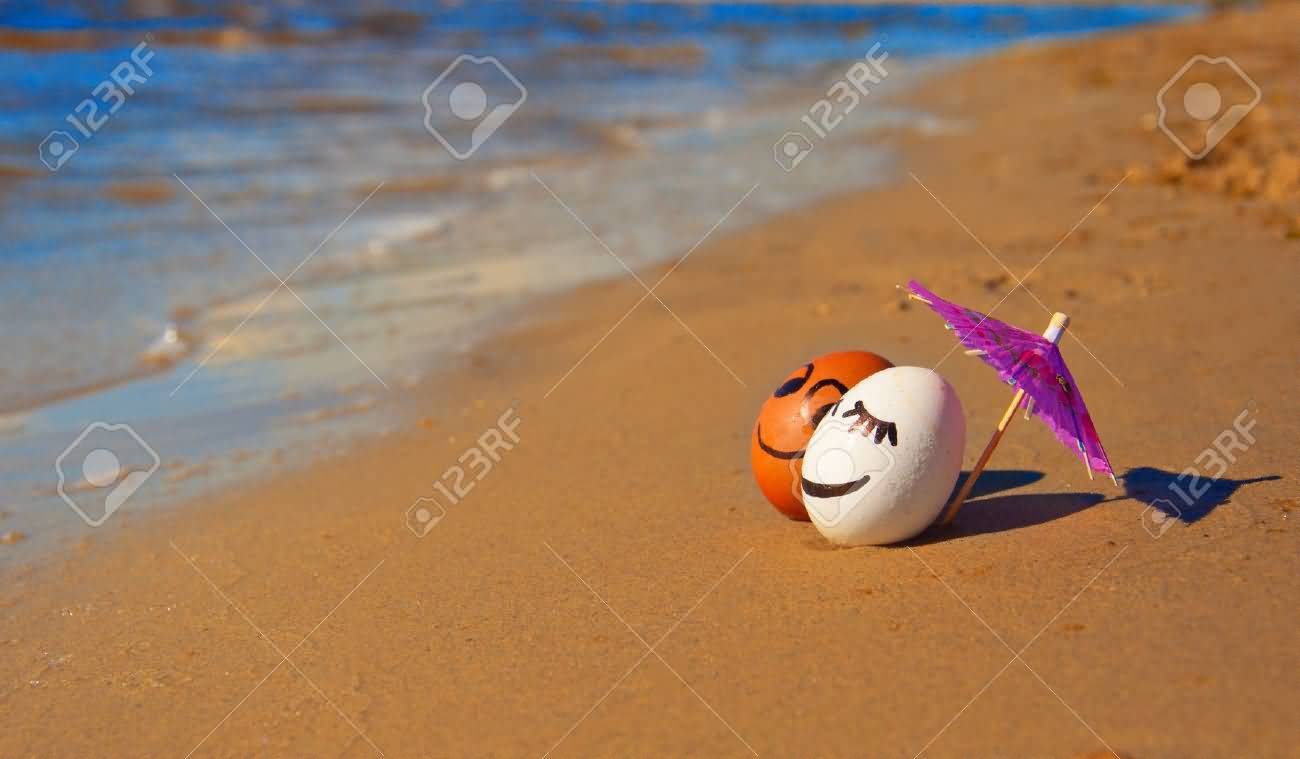 Two Loving Eggs Under Umbrella On A Beach Funny Picture