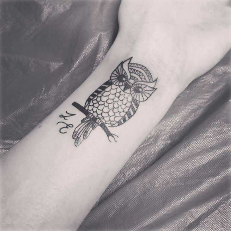 Unique Black And Grey Owl On Branch Tattoo Design For Wrist
