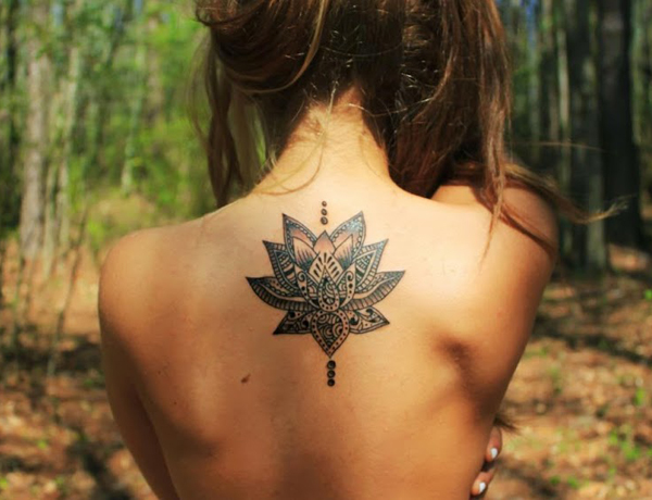 Unique Black Ink Lotus Flower Tattoo On Female Upper Back