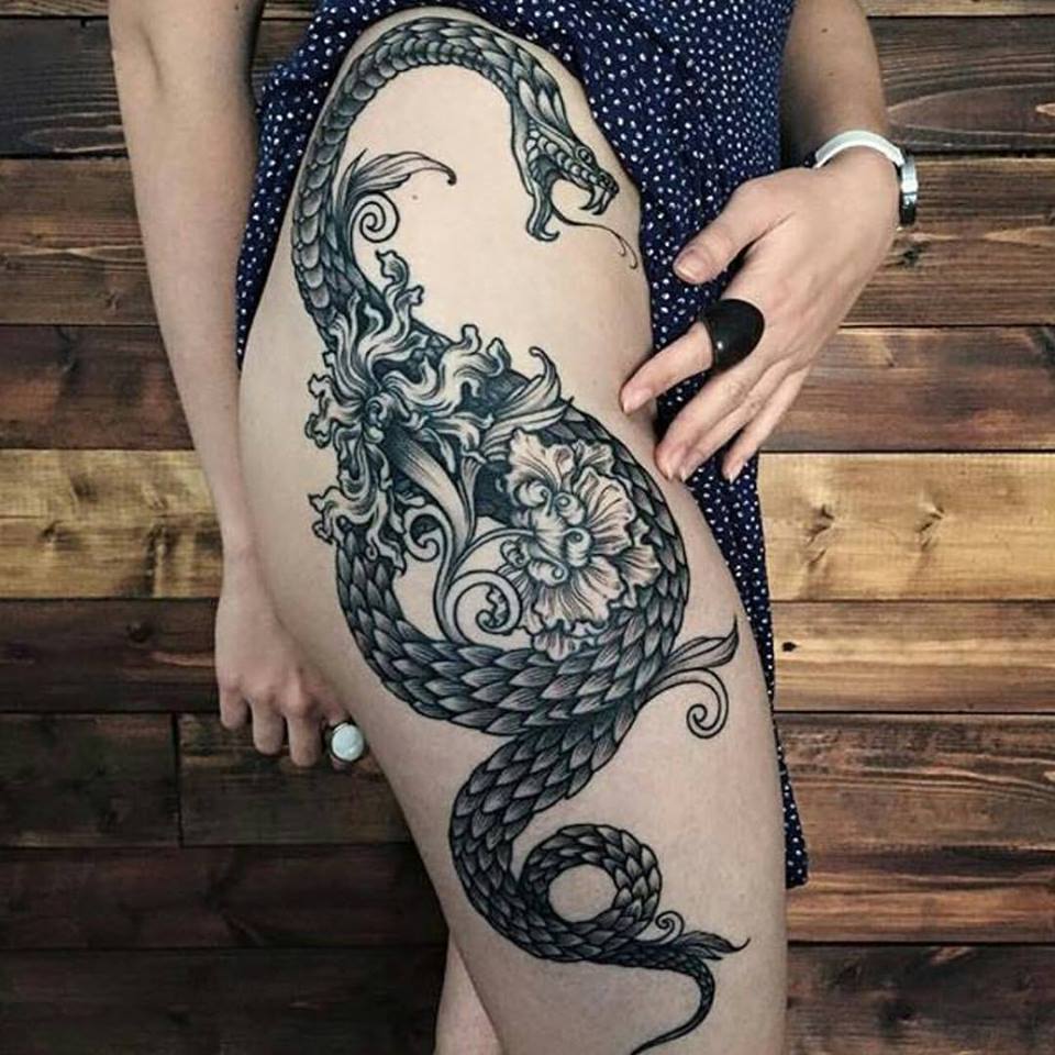 Unique Black Ink Snake Tattoo On Girl Right Hip