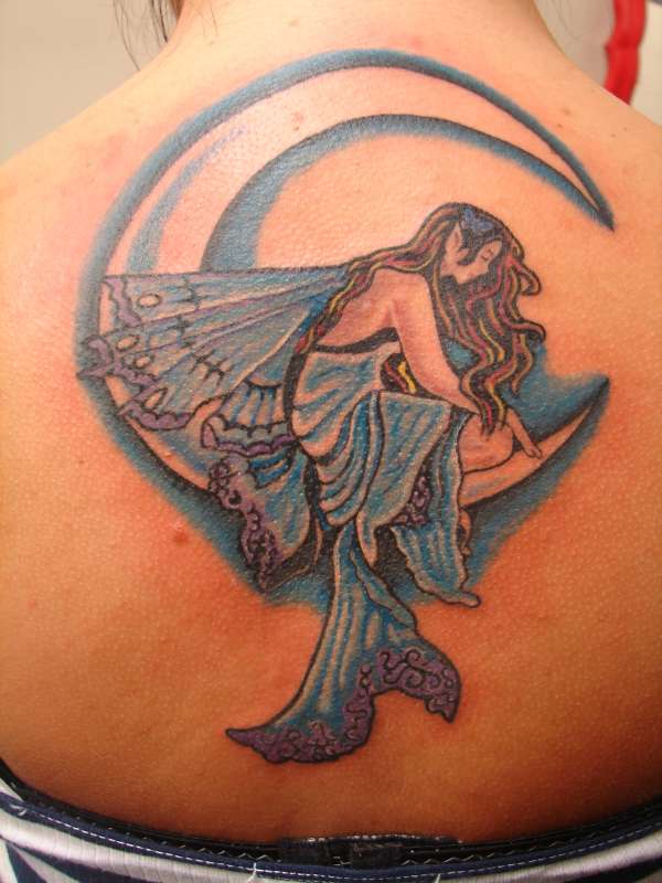 Unique Fairy On Half Moon Tattoo On Girl Upper Back