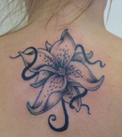 Upper Back Lily Flower Tattoo Idea
