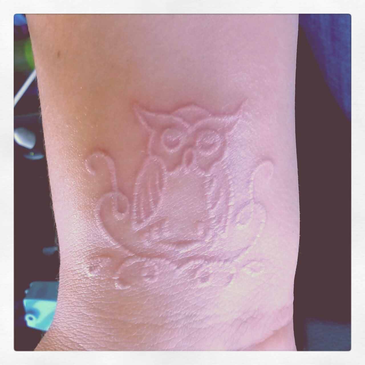 White Ink Owl Tattoo Design For Wrist
