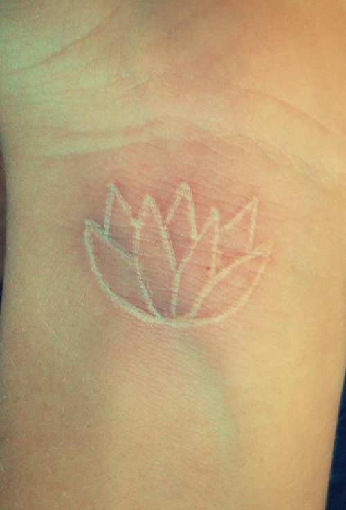 White Outline Lotus Tattoo Design For Wrist