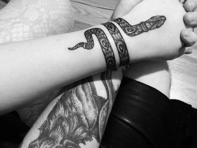 Wonderful Black Ink Snake Tattoo On Left Wrist