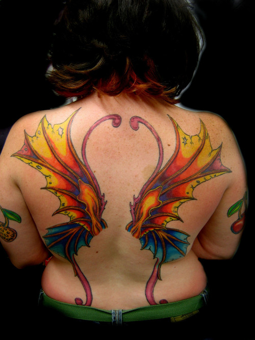 Wonderful Colorful Fairy Wings Tattoo On Girl Upper Back