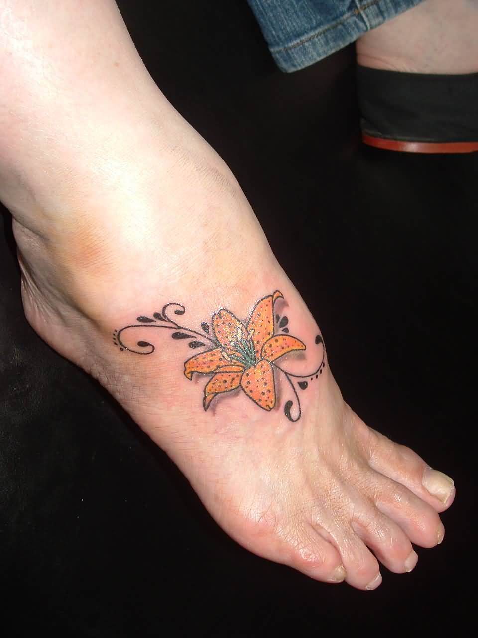 Wonderful Lily Flower Tattoo On Right Foot