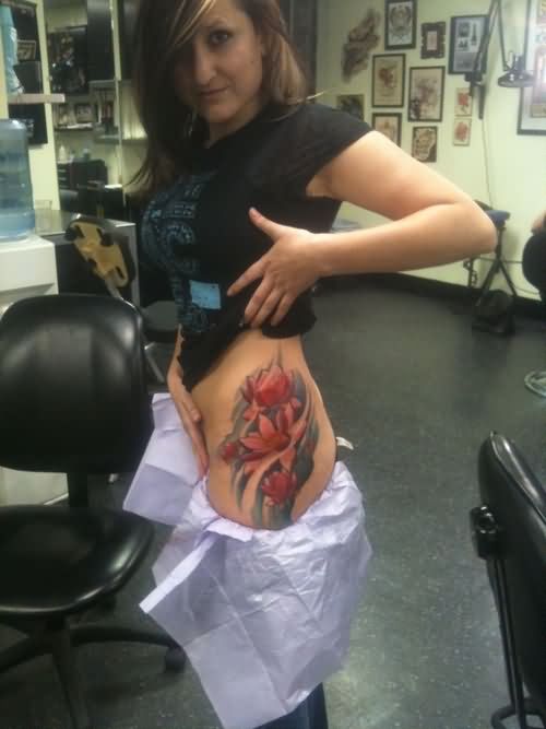 Wonderful Lotus Flowers Tattoo On Girl Left Hip
