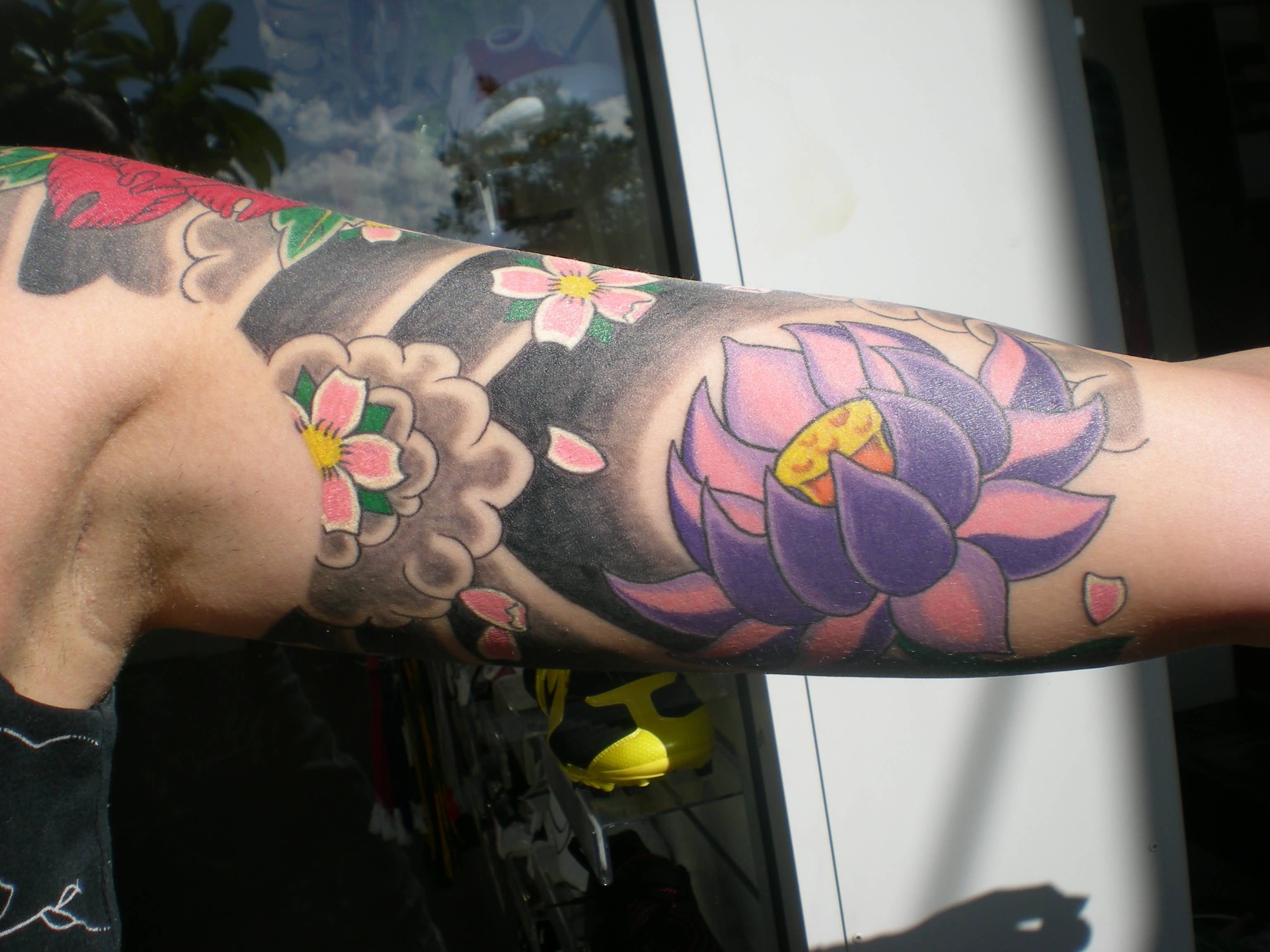 Wonderful Traditional Lotus Flower Tattoo On Left Bicep