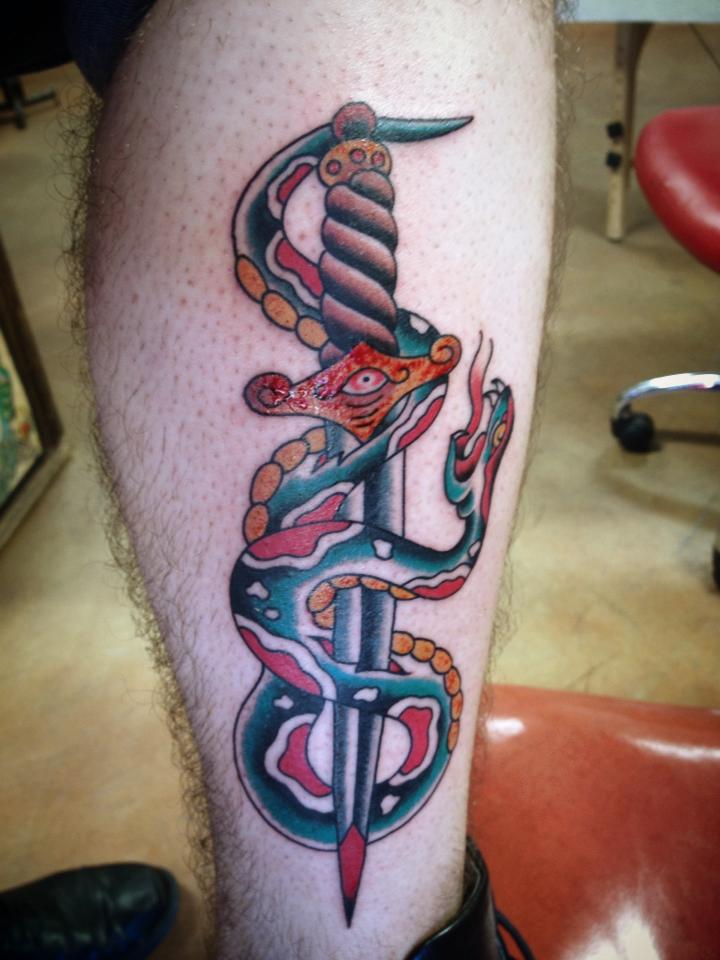 Wonderful Traditional Snake With Dagger Tattoo On Leg