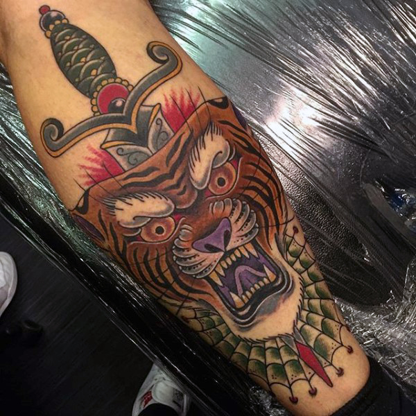 Amazing Spider Web And Tiger Head With Dagger Tattoo On Leg
