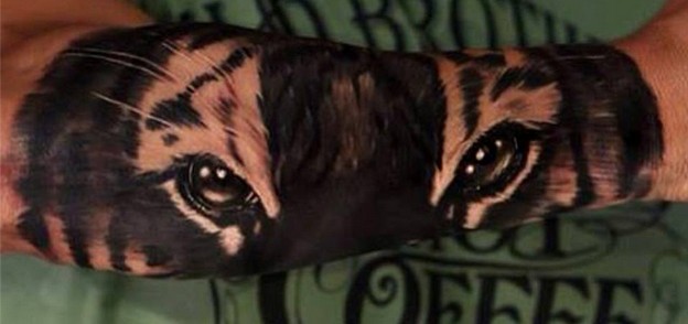 Amazing Tiger Eyes Tattoo On Right Arm