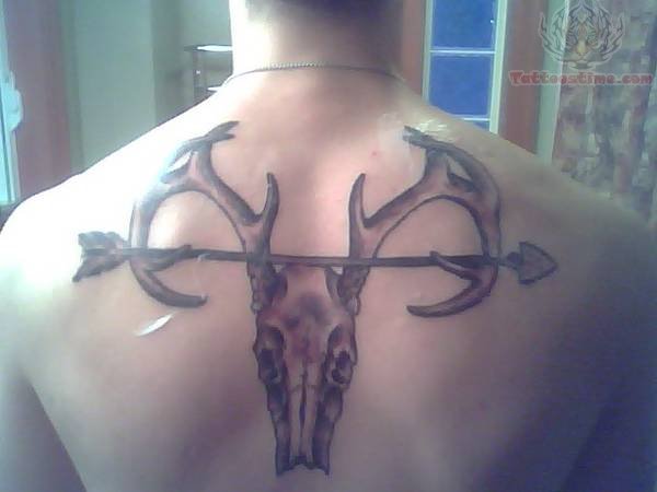 Arrow And Deer Skull Tattoo On Upper Back
