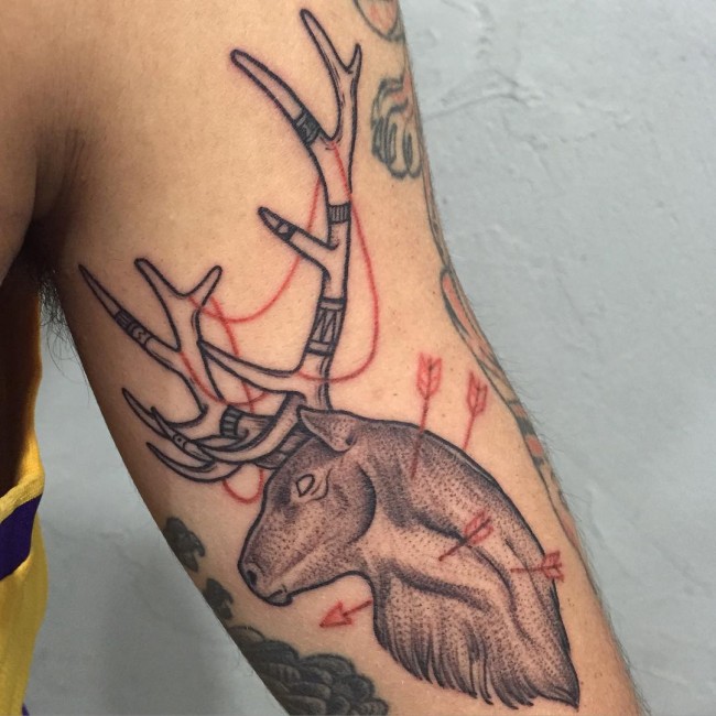 Arrows Pierced In Deer Head Tattoo On Bicep