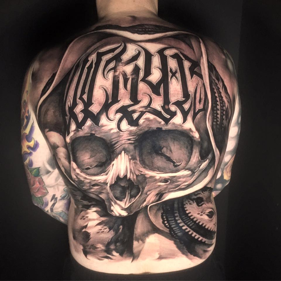 Attractive Black And Grey 3D Skull Tattoo On Man Full Back By Benjamin Laukis
