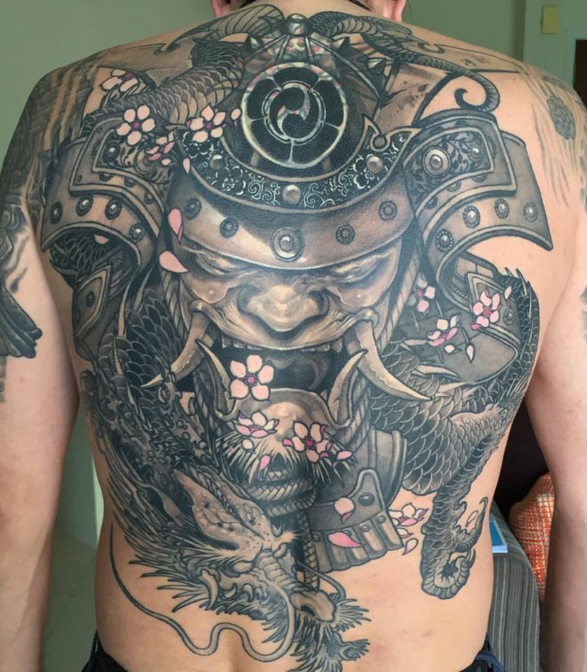 Attractive Black Ink Samurai Head With Dragon Tattoo On Man Full Back
