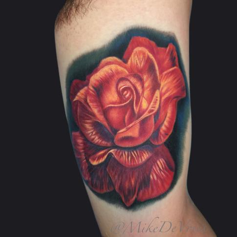 Attractive Rose Tattoo On Left Bicep By Mike Devries
