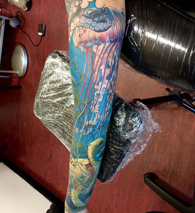 Awesome Jelly Fish With Octopus Tattoo On Left Arm