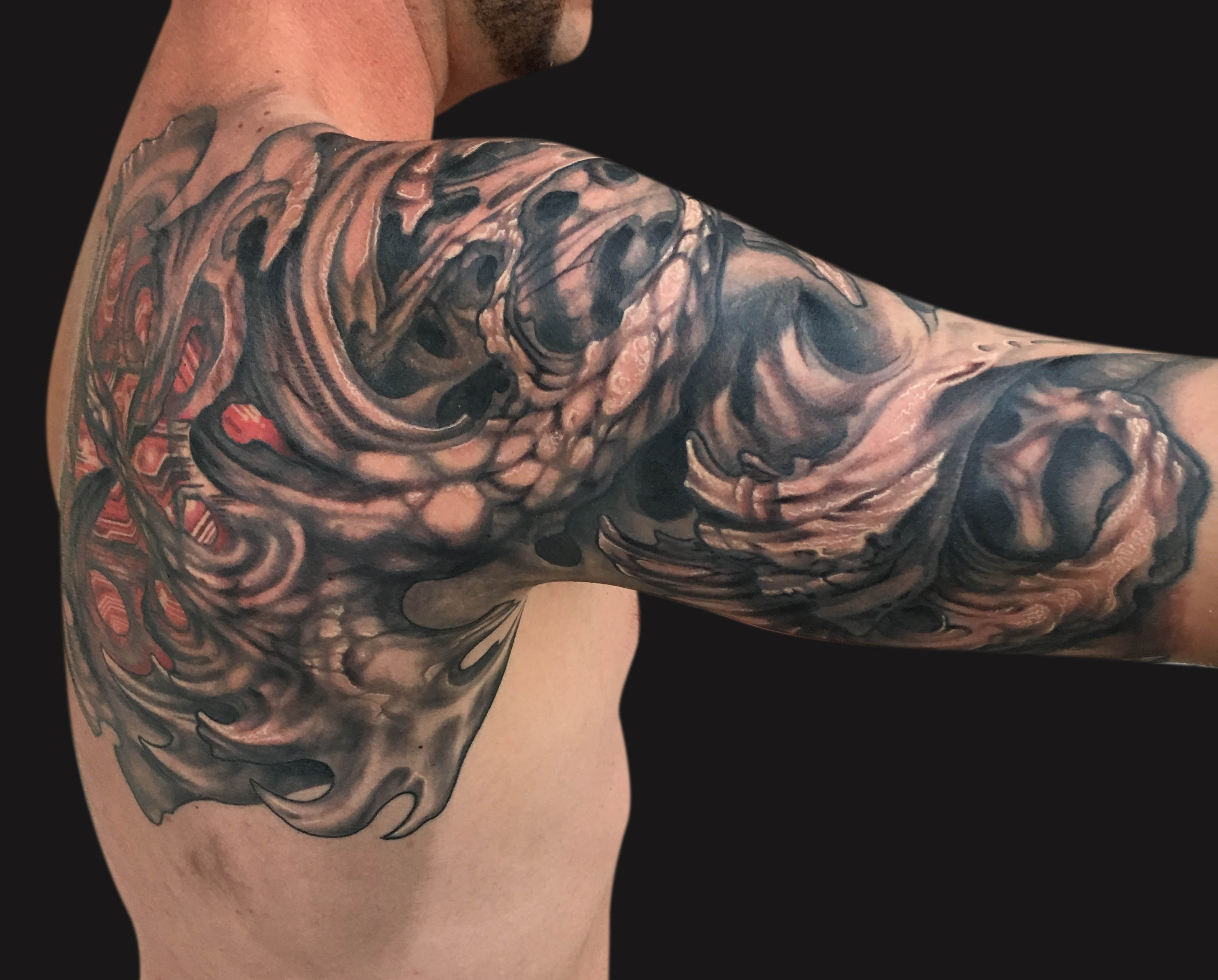 Bio Mechanical Shells Tattoo On Man Right Half Sleeve By Spencer Caligiuri