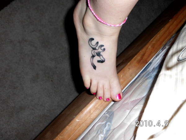 Black And Grey Browning Deer Tattoo On Girl Right Foot