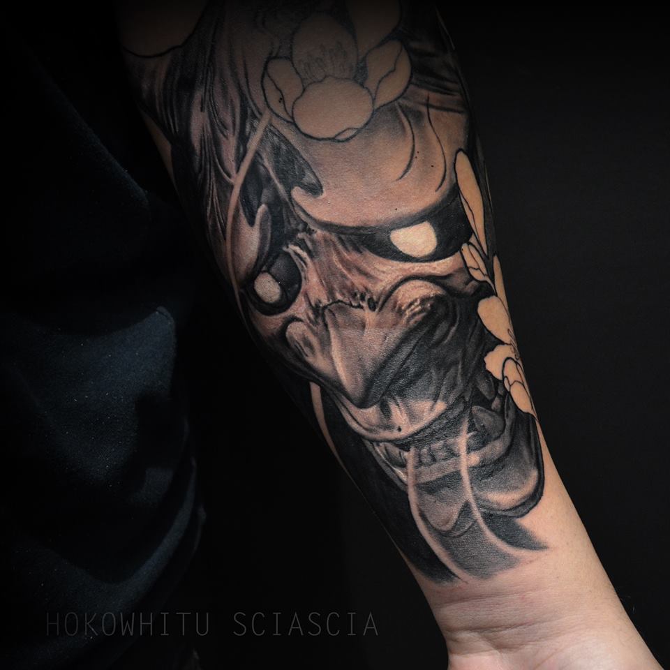 Black And Grey Hannya Mask Tattoo On Left Forearm