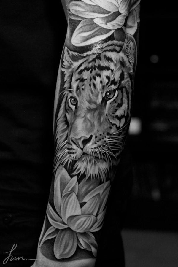 Black And Grey Lotus Flower And Tiger Tattoo On Sleeve