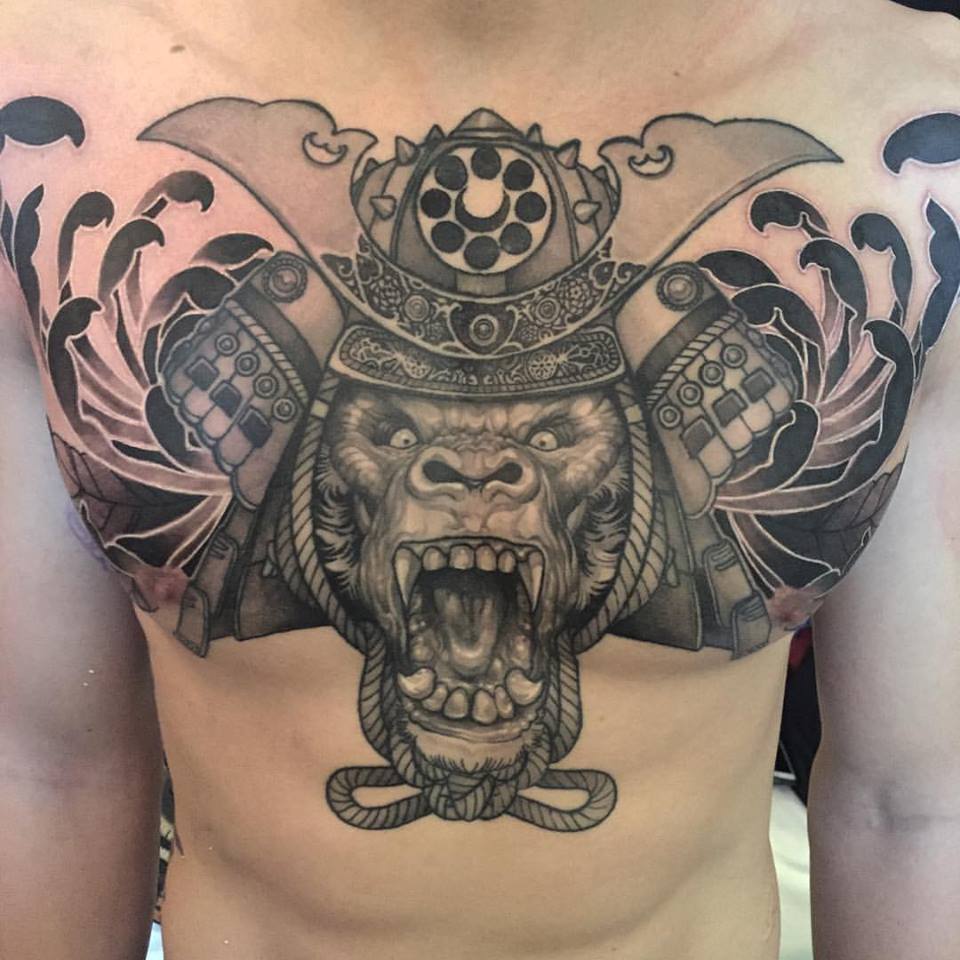 Black And Grey Samurai Monkey Head Tattoo On Man Chest By Elvin