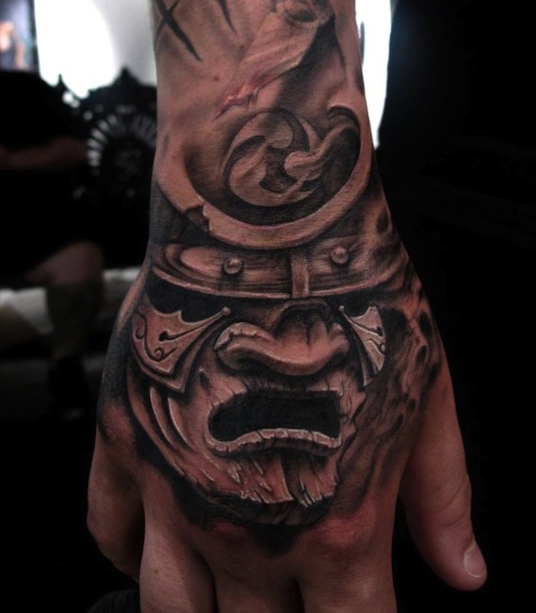 Black And Grey Samurai Warrior Mask Tattoo On Right Hand