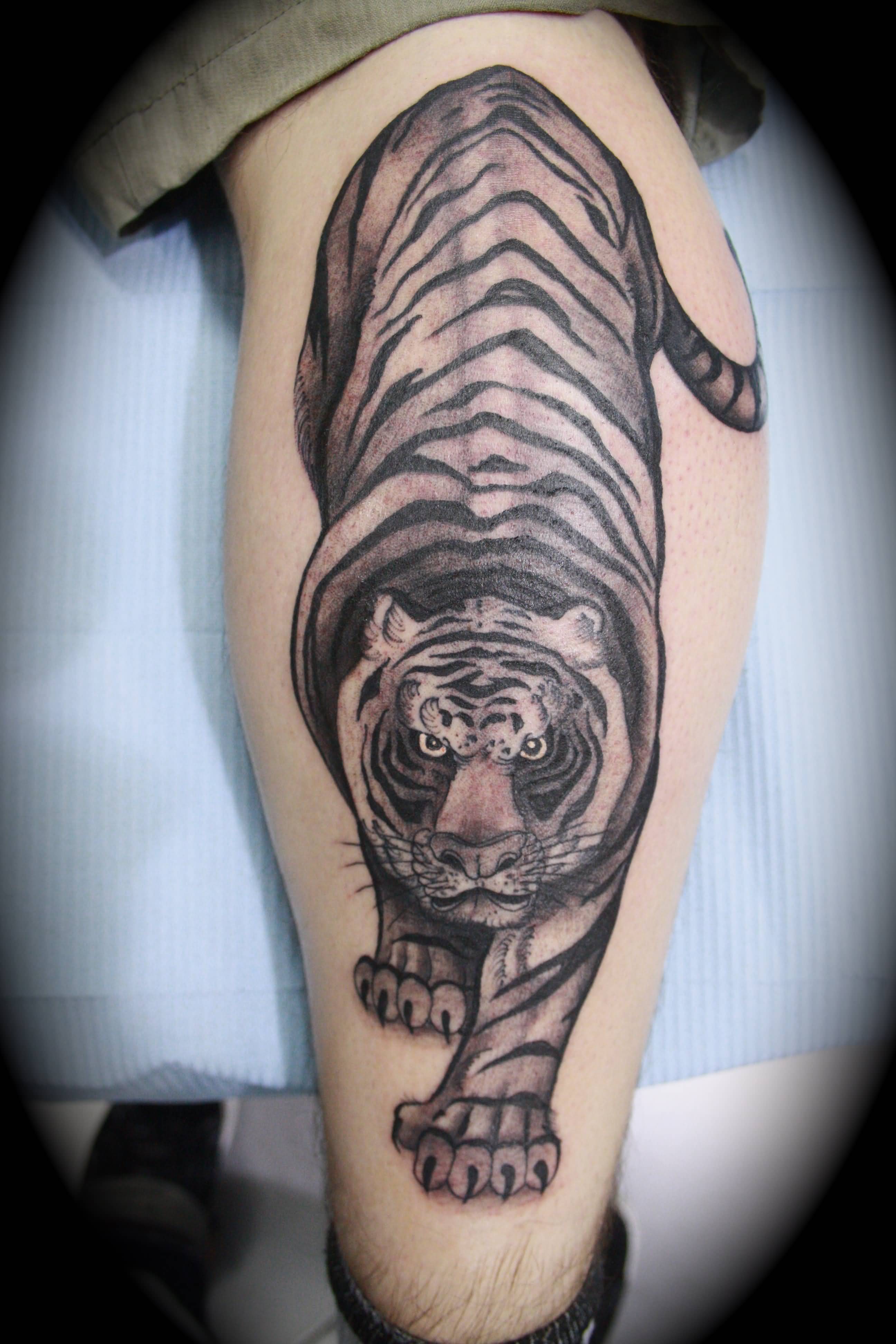 Black And Grey Tiger Tattoo On Leg