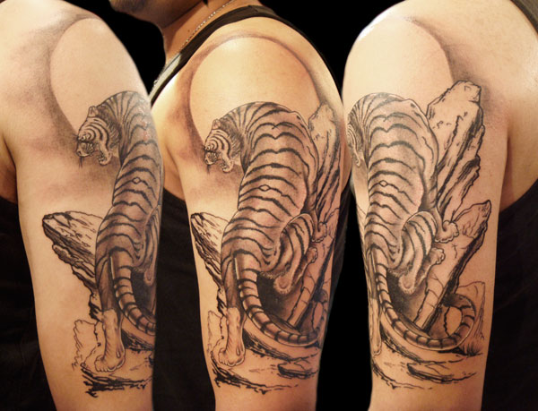 Black And Grey Tiger Tattoo On Man Left Half Sleeve