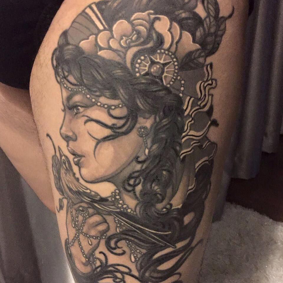 Black And Grey Women Head Tattoo On Left Thigh By Elvin