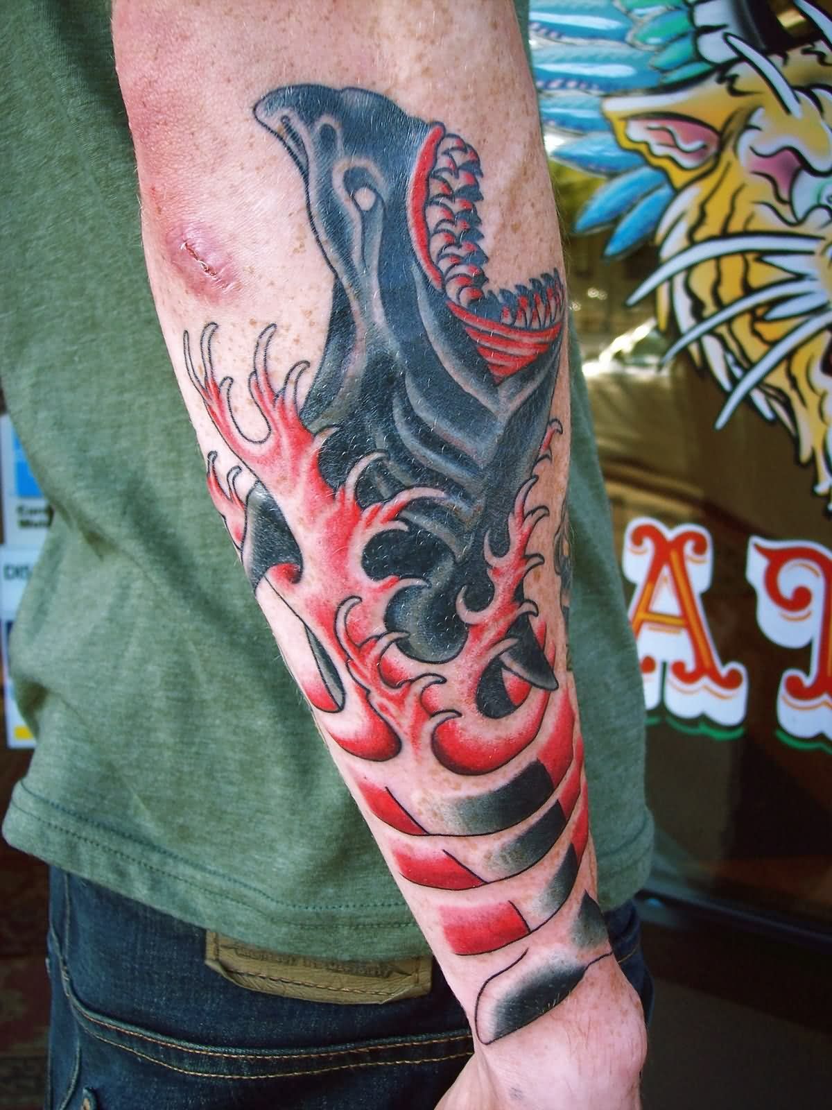 Black And Red Traditional Evil Tiger Shark Tattoo On Man Right Arm