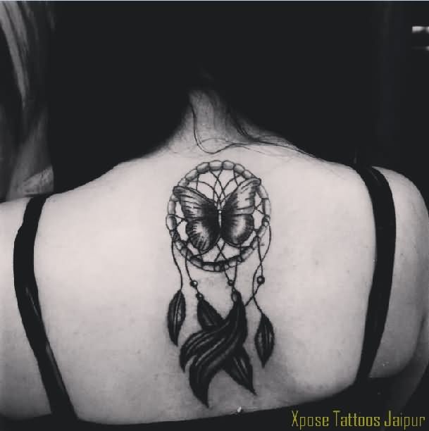 Black Butterfly And Simple Dreamcatcher Tattoo On Upper Back by Xpose Tattoos Jaipur