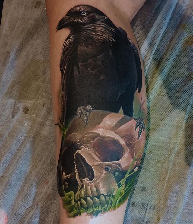 Black Ink Crow On Skull Tattoo On Leg Calf