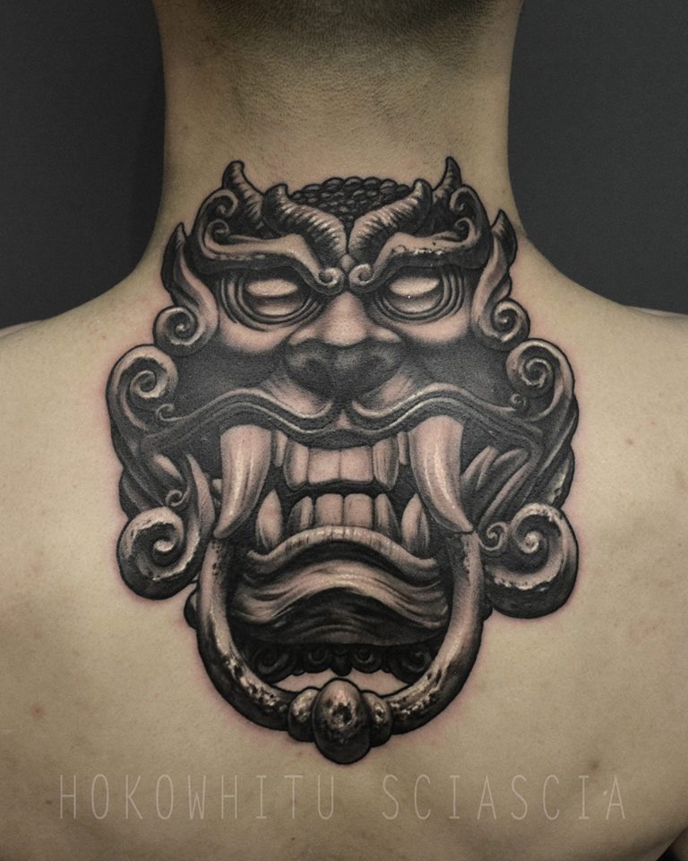 Black Ink Korean Dokkaebi Tattoo On Upper Back