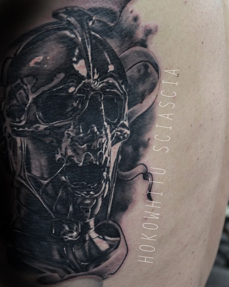 Black Ink Melting Skull Tattoo Design