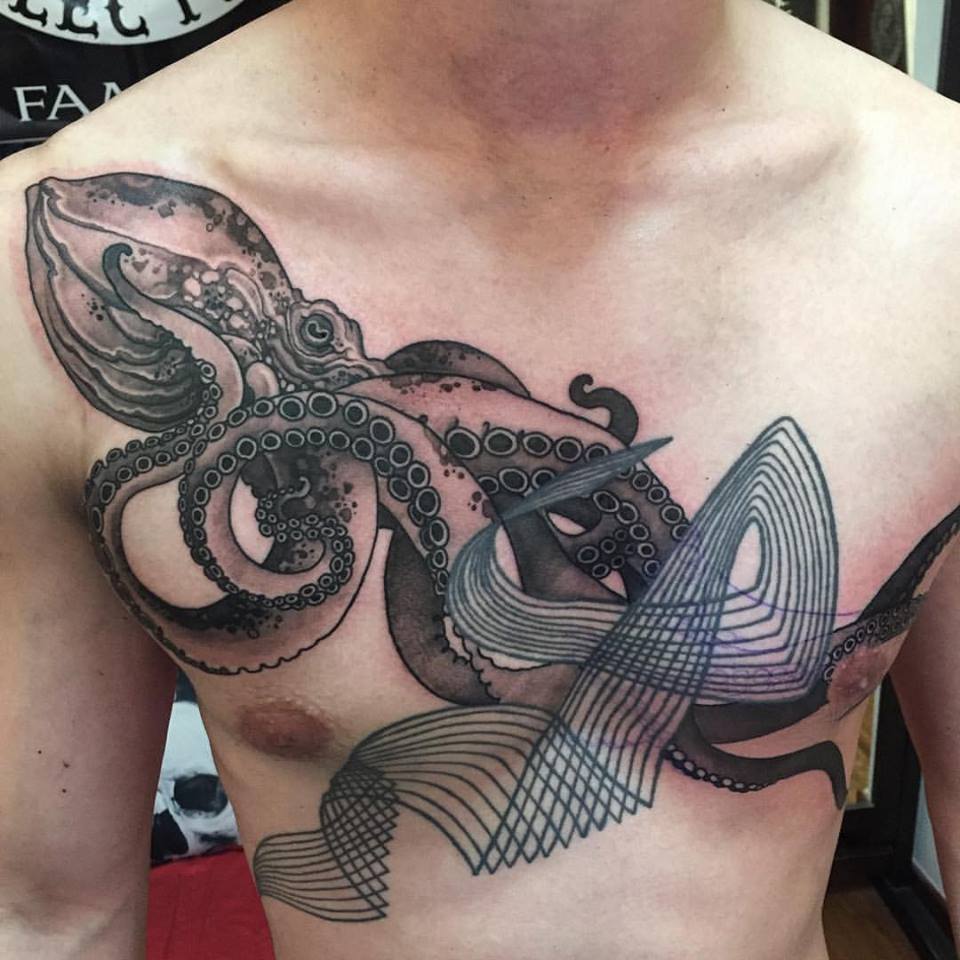 Black Ink Octopus Tattoo On Man Chest