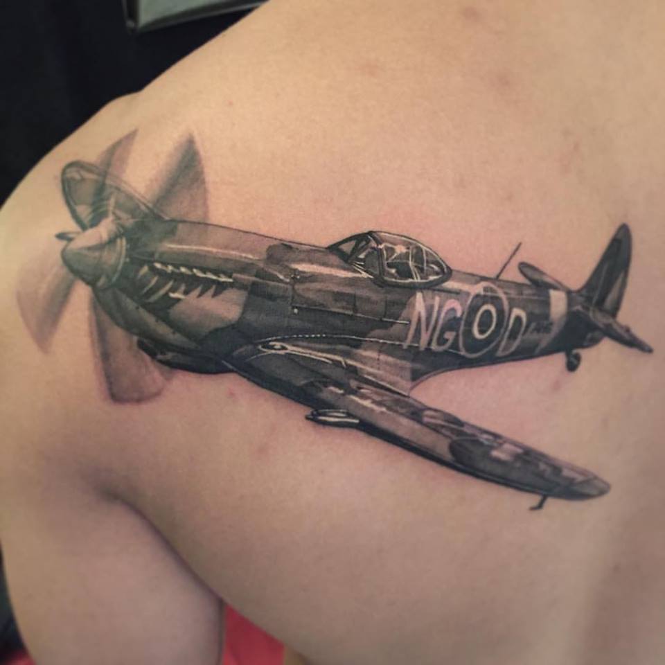Black Ink Plane Tattoo On Man Left Back Shoulder By Elvin