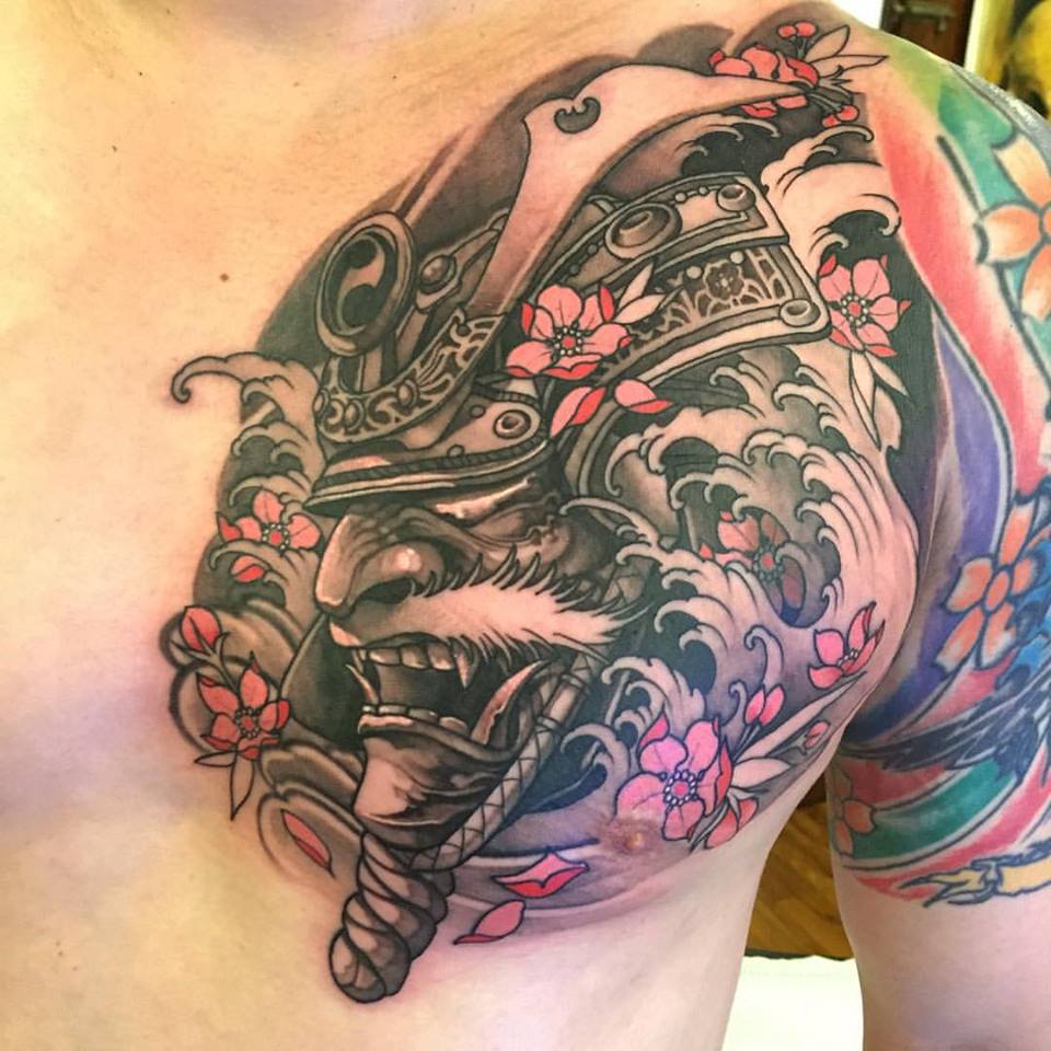 Black Ink Samurai Head Tattoo On Man Left Chest By Elvin