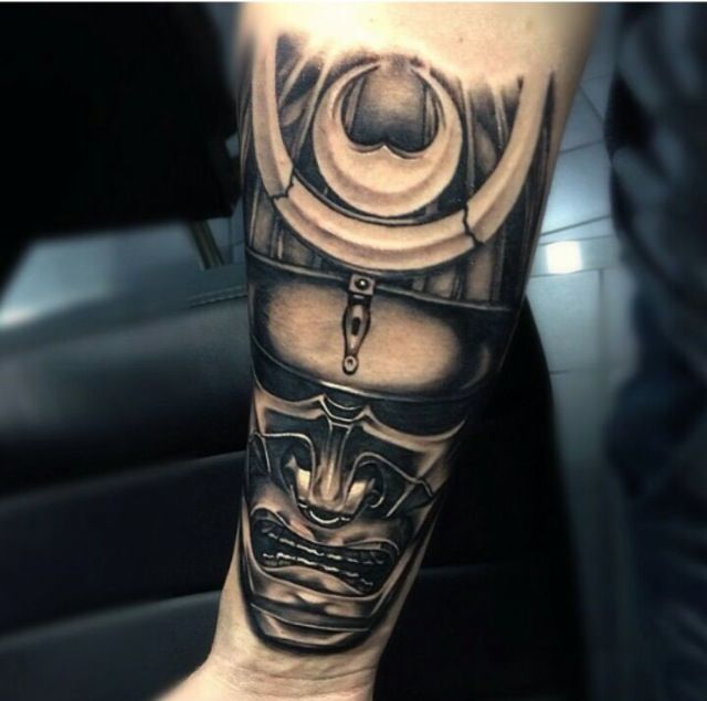 Black Ink Samurai Mask Tattoo On Right Forearm