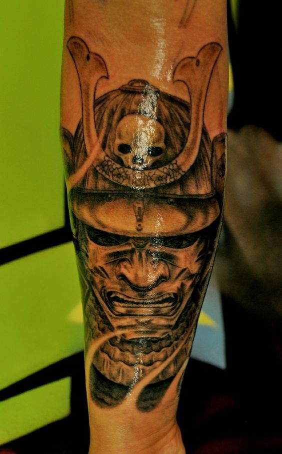 Black Ink Samurai Warrior Head Tattoo On Left Arm
