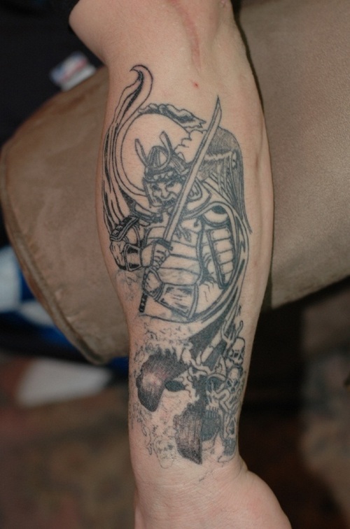 Black Ink Samurai With Sword Tattoo On Left Forearm